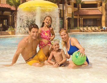 Family at pool at Floridays Resort Orlando.