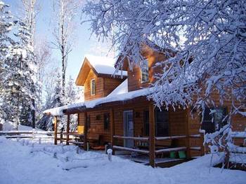 Cabin in Winter at Timber Trail Lodge & Resort