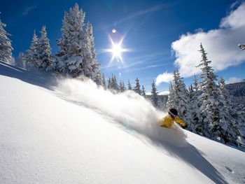 Skiing down Vail Mountain at Vail's Mountain Haus.